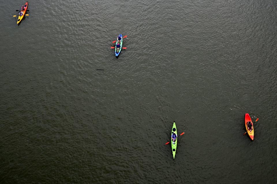 Paddlefest participants kayak down the Ohio River in 2021. Paddlefest is the nation's largest kayaking and canoeing event and has thousands of participants.