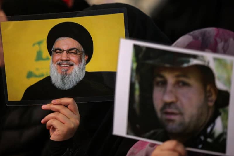 Pro-Iranian Hezbollah supporters attend a mass as Secretary General of Hezbollah Hassan Nasrallah appears to give a televised speech to mark the 4th anniversary of the assassination of Abu Mahdi al-Mohandes, the deputy head of Iraq's Hashd al-Shaabi militia, and Iranian Quds Force commander Qasem Soleiman by a US drone in Iraq in 2020. Marwan Naamnai/dpa