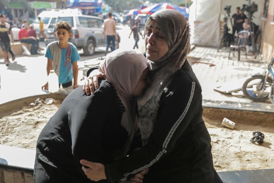 Palestinians react as civilians, injured in Israeli raids, arrive at Nasser Medical Hospital on Nov. 13 in Khan Yunis, Gaza. Heavy fighting rages in the northern Gaza Strip as Israel encircles the area, despite increasingly pressing calls for a cease-fire. The leaders of the main U.N. agencies issued a rare joint statement to express their indignation.