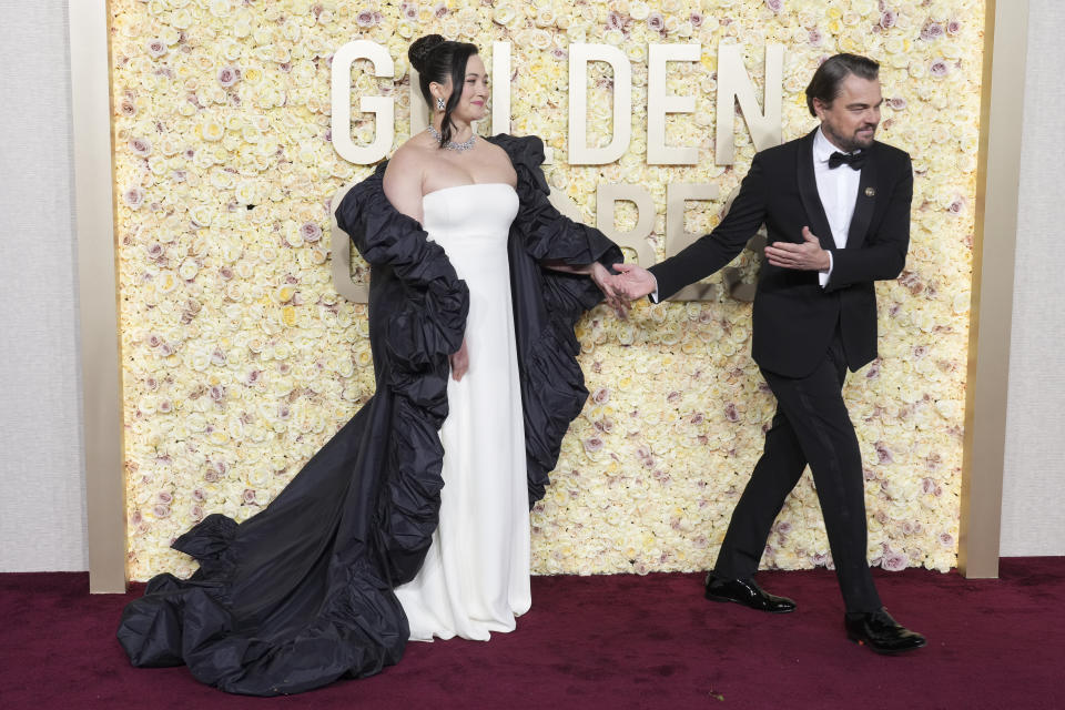 Lily Gladstone, left, and Leonardo DiCaprio arrive at the 81st Golden Globe Awards on Sunday, Jan. 7, 2024, at the Beverly Hilton in Beverly Hills, Calif. (Photo by Jordan Strauss/Invision/AP)