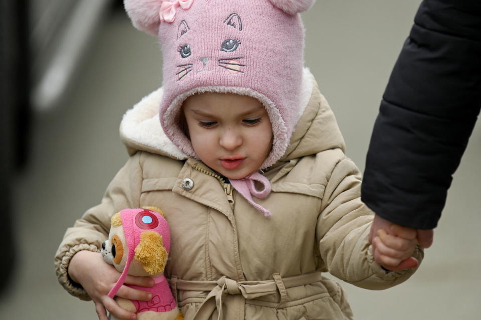 A child arrives to the border of Ukraine-Slovakia, after Russia launched a massive military operation against Ukraine, in Vysne Nemecke, Slovakia, February 25, 2022. REUTERS/Radovan Stoklasa