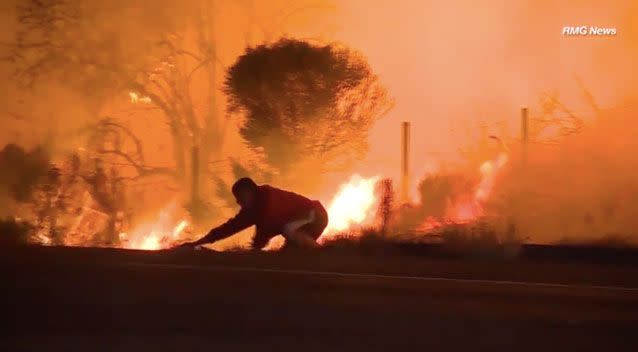 Footage shows the Mr Gonzalez chasing a wild rabbit heading into the flames. Photo: RMG News