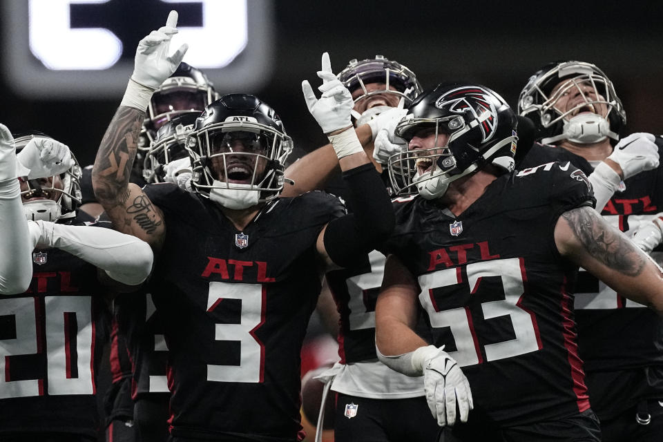 Atlanta Falcons celebrate Atlanta Falcons safety Jessie Bates III (3) interception during the second half of an NFL football game against the Indianapolis Colts, Sunday, Dec. 24, 2023, in Atlanta. (AP Photo/John Bazemore)