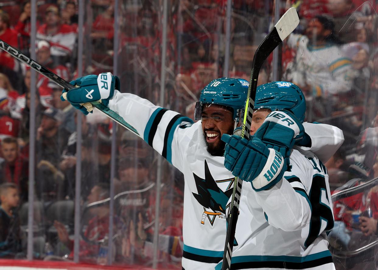 NEWARK, NEW JERSEY - DECEMBER 01: Anthony Duclair #10 celebrates with teammate Mikael Granlund #64 of the San Jose Sharks after Granlund scored during the third period against the New Jersey Devils at Prudential Center on December 01, 2023 in Newark, New Jersey. The San Jose Sharks defeated the New Jersey Devils 6-3.