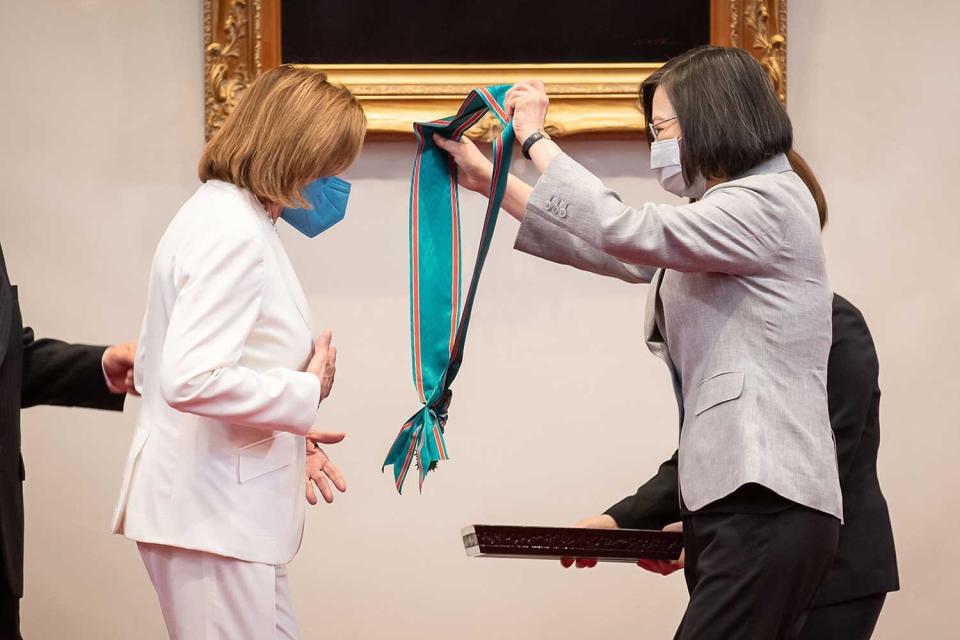 Speaker of the U.S. House Of Representatives Nancy Pelosi (D-CA), left, receives the Order of Propitious Clouds with Special Grand Cordon, Taiwan’s highest civilian honour, from Taiwan's President Tsai Ing-wen, right, at the president's office on August 03, 2022 in Taipei, Taiwan. Pelosi arrived in Taiwan on Tuesday as part of a tour of Asia aimed at reassuring allies in the region, as China made it clear that her visit to Taiwan would be seen in a negative light.