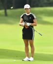 Hinako Shibuno of Japan prepares for a putt on the 18th green during the final round of the LPGA Honda Thailand golf tournament in Pattaya, southern Thailand, Sunday, May 9, 2021. (AP Photo/Kittinun Rodsupan)