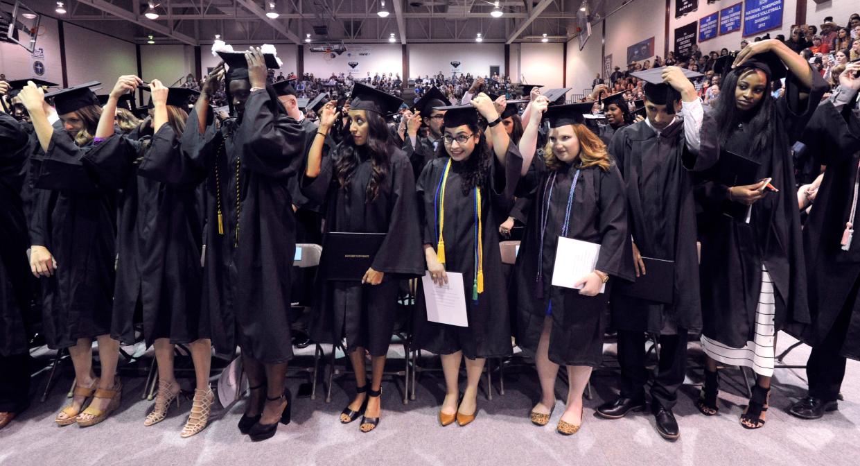 McMurry University students switch their tassels to hang on the opposite side of their mortarboard hats in May 2017. McMurry, along with Abilene Christian and Hardin-Simmons, has plans and programs in place to ensure that a more diverse student population stays the course and graduates.