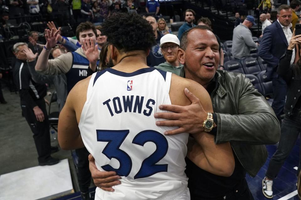 Timberwolves minority owner Alex Rodriguez hugs forward Karl-Anthony Towns after Towns hit the game-winning shot to beat the Atlanta Hawks in a March 22, 2023 game.