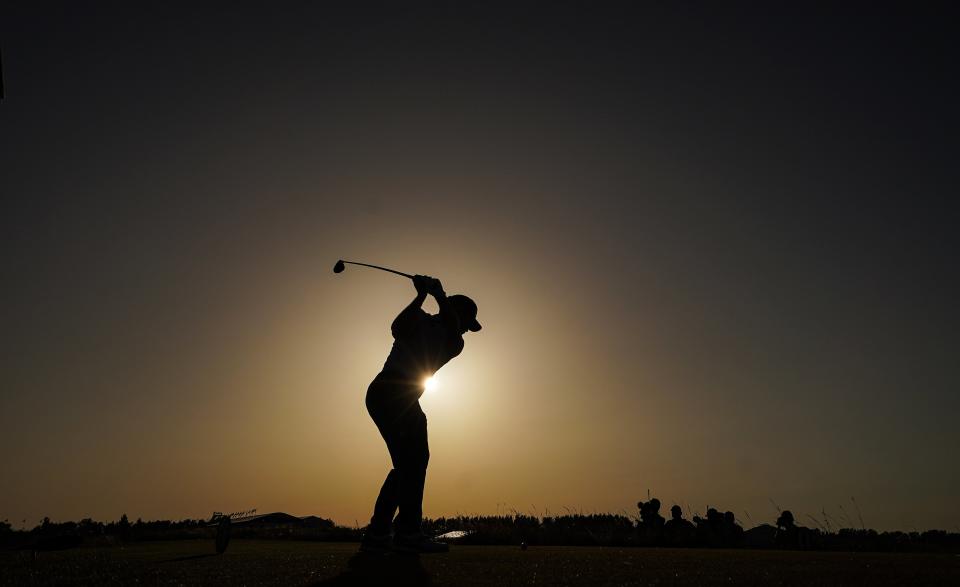 Louis Oosthuizen tees off on the 18th during day three of the 149th Open (PA Wire)