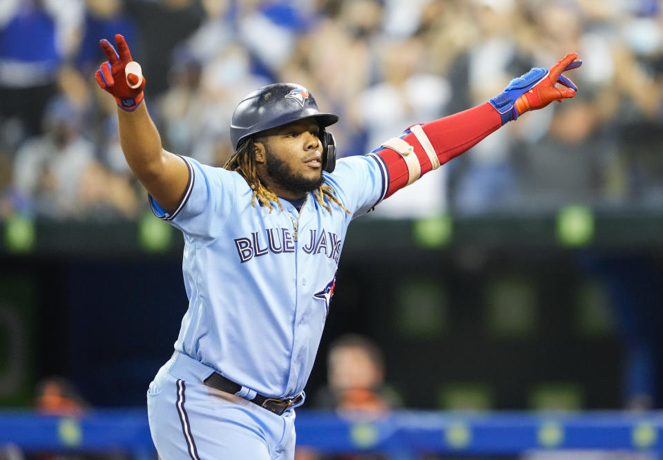 TORONTO, ONTARIO - OCTOBER 3: Vladimir Guerrero Jr. #27 of the Toronto Blue Jays celebrate his home run against the Baltimore Orioles in the second inning during their MLB game at the Rogers Centre on October 3, 2021 in Toronto, Ontario, Canada. (Photo by Mark Blinch/Getty Images)