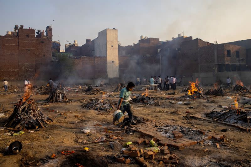 Funeral pyres of people, who died due to the coronavirus disease (COVID-19), are pictured at a crematorium ground in New Delhi