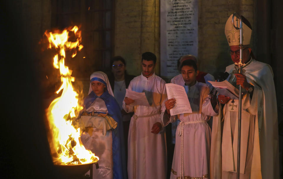 Iraqi Christians attend a Christmas mass at the Mother Teresa Catholic Church in Basra, Iraq, Sunday, Dec. 24, 2023. (AP Photo/Nabil al-Jurani)