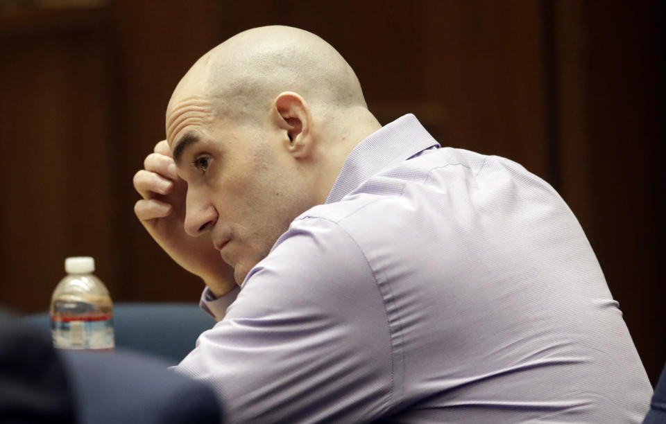 Michael Gargiulo listens to his attorney's closing arguments in the trial of People vs. Michael Gargiulo Wednesday, Aug. 7, 2019, in Los Angeles. Closing arguments continued Wednesday in the trial of an air conditioning repairman charged with killing two Southern California women and attempting to kill a third. (AP Photo/Marcio Jose Sanchez, Pool)