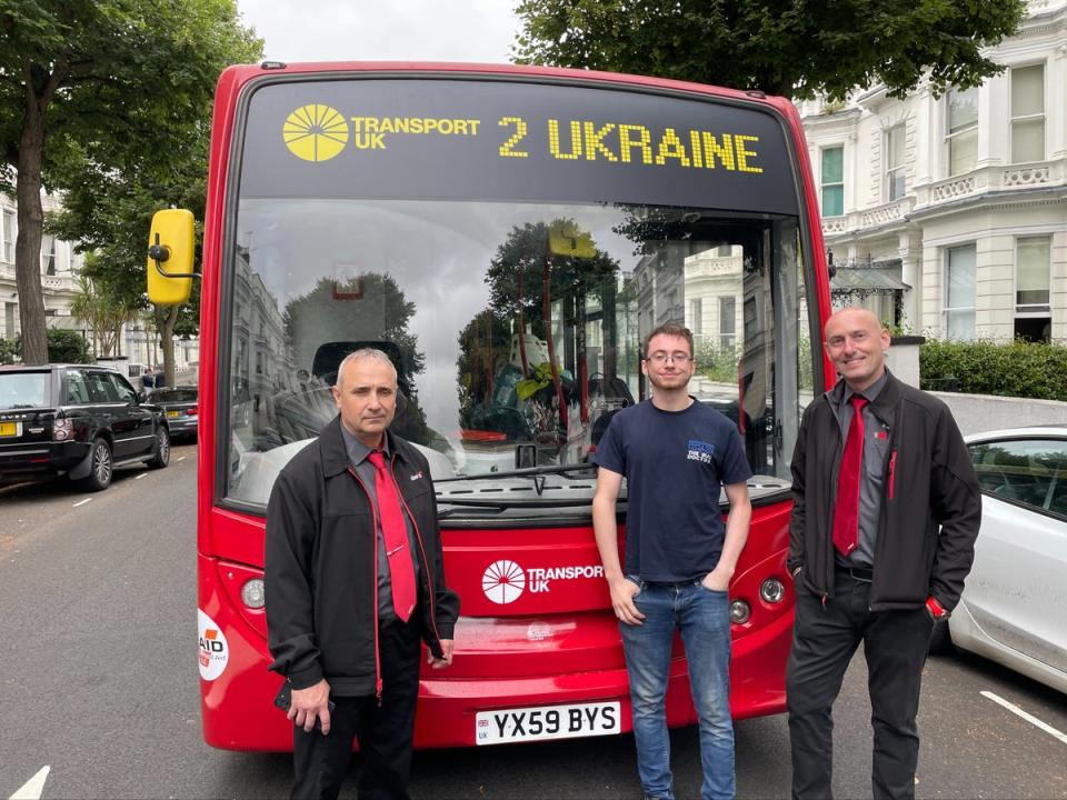 Ukrainian-born Serhiy, engineer Reece and Polish-born Piotr posed in front of their repurposed London bus, packed with humanitarian aid and ready to be driven to Ukraine (Tom Watling)