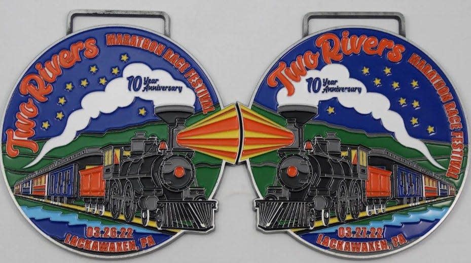 Two Rivers Marathon 10th anniversary medals, one for each day (March 26-27) interlock as shown here.
/ Courtesy Mark Hughes