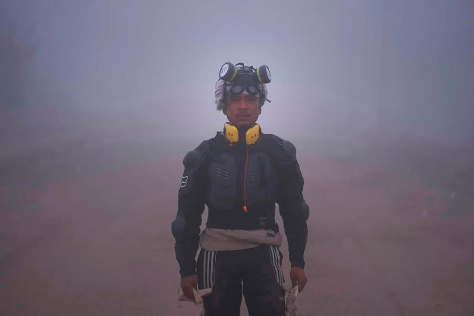 A farmer equipped to face police tear gas poses for a photo as Indian farmers who have been protesting for a week to demand guaranteed crop prices wait to march to the capital near Shambhu border that divides northern Punjab and Haryana states, some 200km from New Delhi, India, Wednesday, 21 February 2024 (AP)