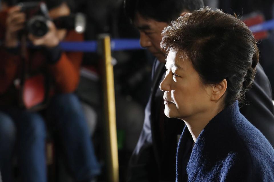 South Korea's ousted leader Park Geun-hye arrives at the prosecutor's office in Seoul, South Korea, Tuesday, March 21, 2017. Park said she was "sorry" to the people as she arrived Tuesday at a prosecutors' office for questioning over a corruption scandal that led to her removal from office. (Kim Hong-ji/Pool Photo via AP)
