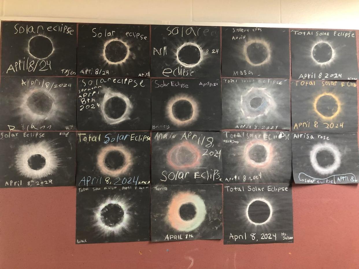 Chalk pictures of the solar eclipse that grade 3 students from Ross R. MacKay Public School drew. (Karis Mapp/CBC  - image credit)