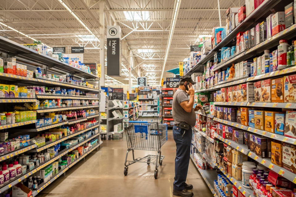 HOUSTON, TEXAS - JULY 08: A customer shops for nutrition products in a Walmart Supercenter on July 08, 2022 in Houston, Texas. Consumer goods continue seeing shortages as the country grapples with ongoing supply chain issues stemming from the pandemic.  (Photo by Brandon Bell/Getty Images)