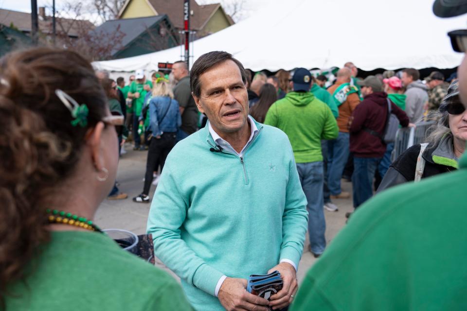 Brad Chambers, an Indiana Republican gubernatorial candidate, talks to people during the Indianapolis Firefighters Emerald Society’s St. Paddy’s Day Tent Party on Friday, March 15, 2024, in Indianapolis.
