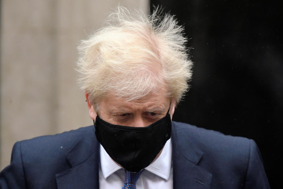 Britain's Prime Minister Boris Johnson, wearing a protective mask, leaves 10 Downing Street in London, Britain October 21, 2020. REUTERS/Toby Melville