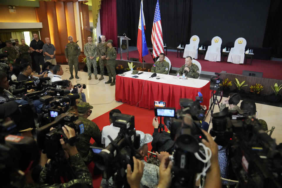 U.S. Marine Corps Major General Eric Austin, right, U.S. Exercise Director Representative, right, with Philippine Army Major General Marvin Licudin, Philippine Exercise Director, answers a question from a reporter after the opening ceremonies of a joint military exercise flag called "Balikatan," a Tagalog word for "shoulder-to-shoulder," at Camp Aguinaldo military headquarters Tuesday, April 11, 2023, in Quezon City, Philippines. The United States and the Philippines on Tuesday launch their largest combat exercises in decades that will involve live-fire drills, including a boat-sinking rocket assault in waters across the South China Sea and the Taiwan Strait that will likely inflame China. (AP Photo/Aaron Favila)