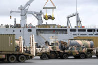 Emergency relief supplies for those affected by Cyclone Debbie are loaded onto the Royal Australian Navy Ship HMAS Choules at the Port of Brisbane in Australia, March 29, 2017. AAP/Dave Hunt/via REUTERS