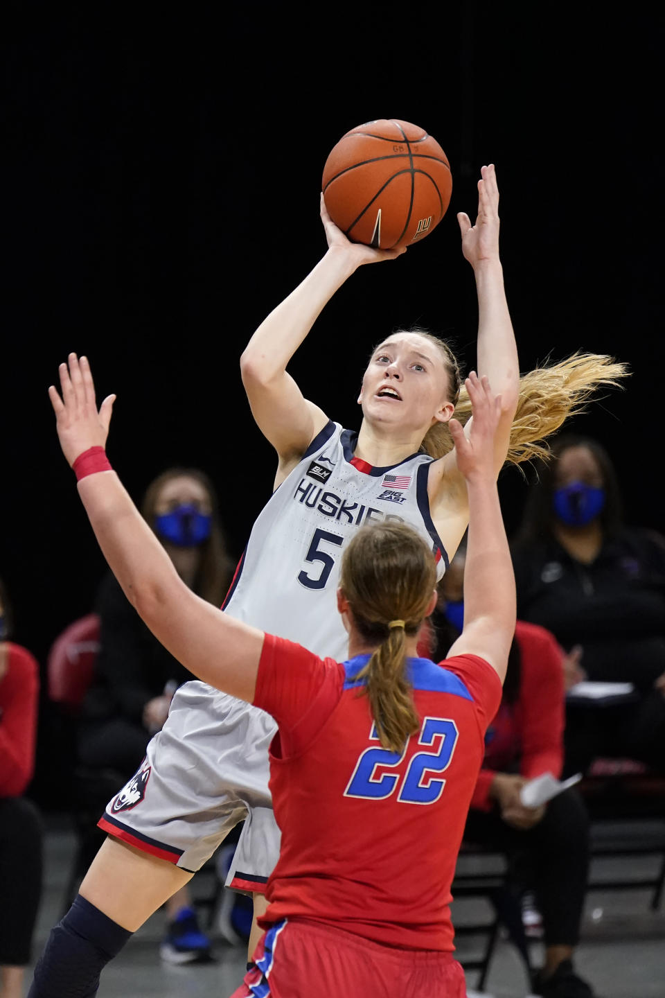 FILE - Connecticut's Paige Bueckers (5) shoots over DePaul's Jorie Allen during the first half of an NCAA college basketball game in Chicago, in this Sunday, Jan. 31, 2021, file photo. Bueckers has made The Associated Press All-America first team, announced Wednesday, March 17, 2021. (AP Photo/Charles Rex Arbogast, File)