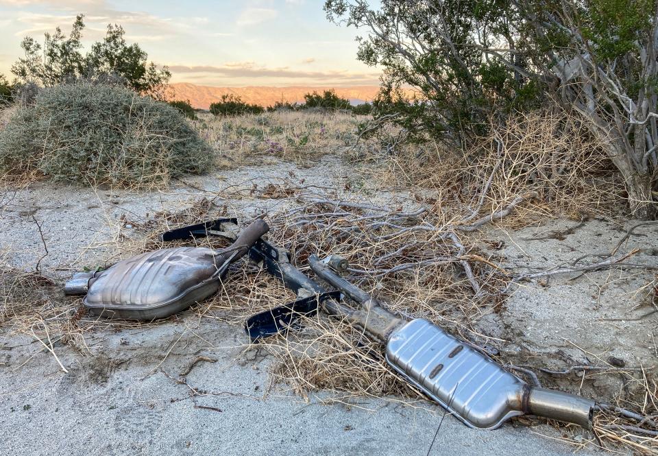 A pair of catalytic converters are dumped in the desert in northwest Palm Springs in 2023.