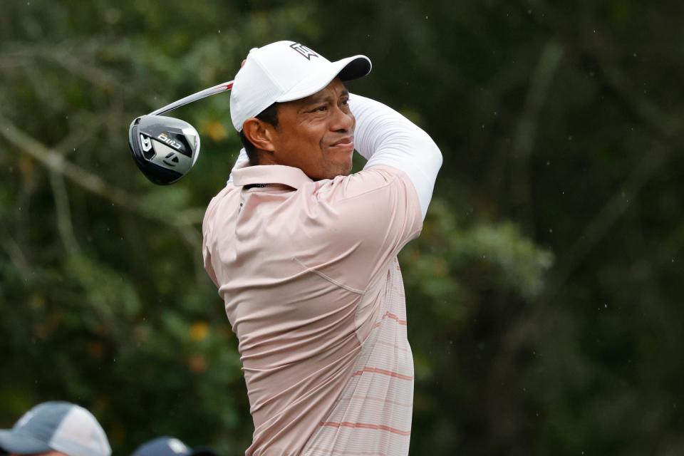 Tiger Woods plays his shot from the seventh tee during the PNC Championship at The Ritz-Carlton Golf Club.