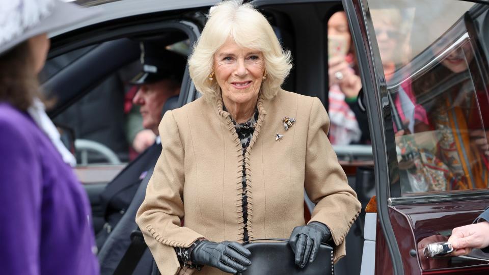 The Queen looked pristine in a suede Anna Valentine coat and Russell & Bromley boots