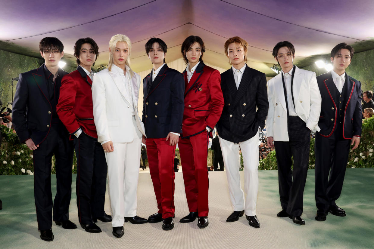 Bang Chan, Han, Felix, Seungmin, Hyunjin, I.N, Lee Know, and Changbin of Stray Kids attend The 2024 Met Gala (Image provided by Tommy Hilfiger: Photo by Kevin Mazur/MG24/Getty Images for The Met Museum/Vogue)
