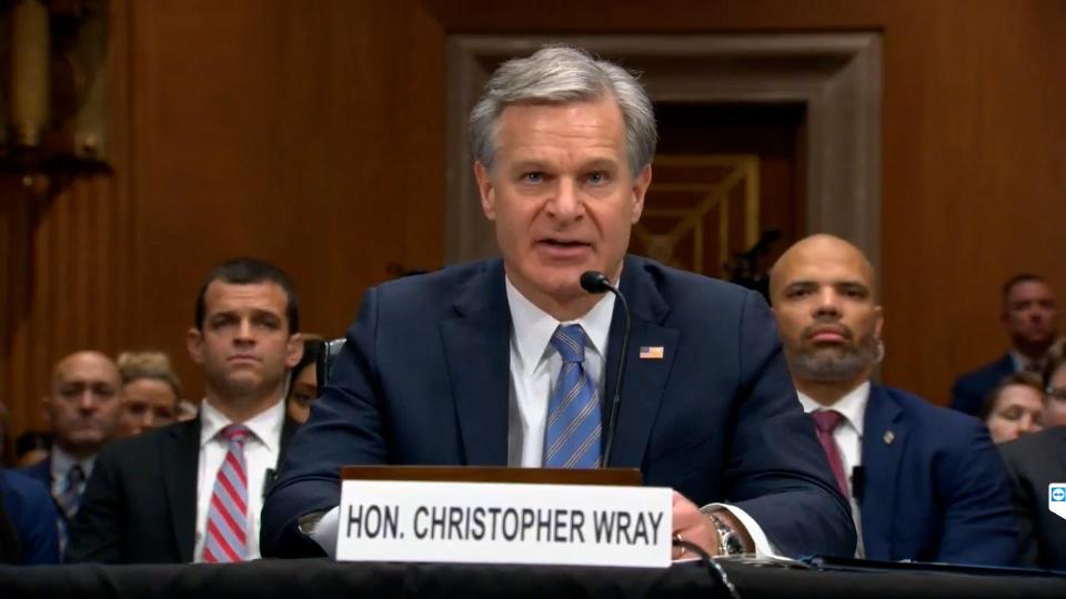 Christopher Wray, Director of the Federal Bureau of Investigation, address members of Congress during a hearing of the Senate Judiciary Committee.