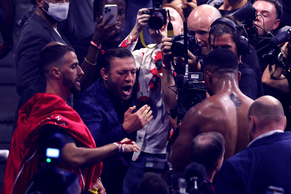 LONDON, ENGLAND - AUGUST 12: Mixed Martial Artist Conor McGregor celebrates victory with Anthony Joshua after he knocked out Robert Helenius during the Heavyweight fight between Anthony Joshua and Robert Helenius at The O2 Arena on August 12, 2023 in London, England. (Photo by Julian Finney/Getty Images)