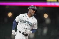 Seattle Mariners' Kyle Lewis rounds the bases after he hit a three-run home run against the Baltimore Orioles during the eighth inning of a baseball game, Tuesday, May 4, 2021, in Seattle. (AP Photo/Ted S. Warren)