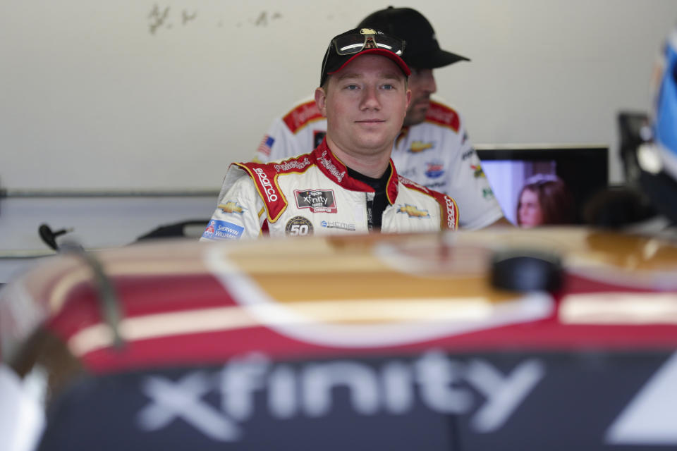 NASCAR Xfinity Series driver Tyler Reddick waits in the garage area before the start of NASCAR Xfinity auto racing practice at Indianapolis Motor Speedway, Friday, Sept. 6, 2019 in Indianapolis. (AP Photo/Michael Conroy)