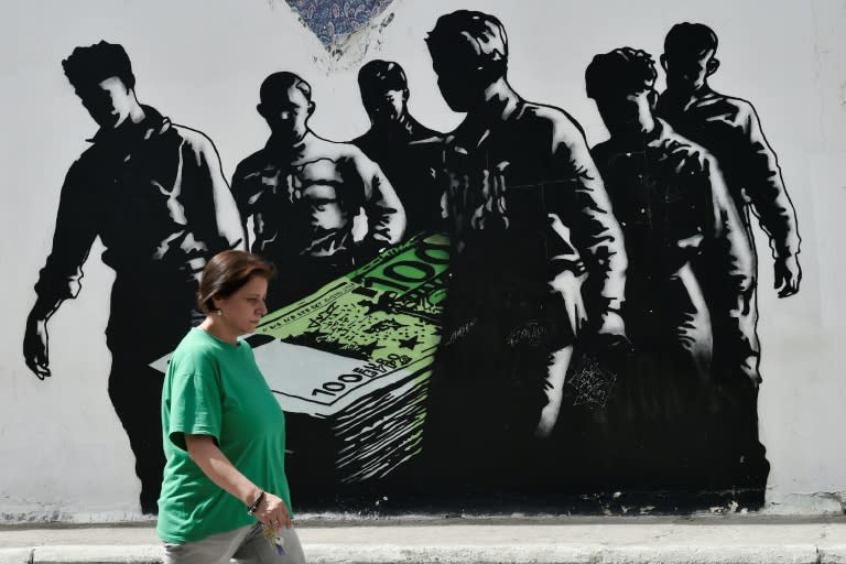 Graffiti in Athens by French street artist Goin. Greece's return to the bond markets is a psychological milestone, demonstrating that the country is back on the road to weaning itself off bailout aid