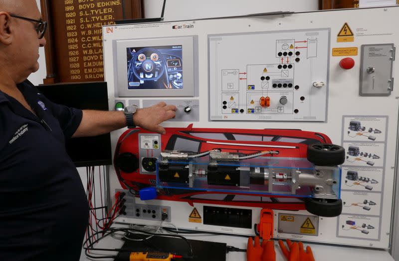 Motor Trade Association NSW Continuous Development Manager, Anthony Tomassetti, looks at an electric vehicle model used for up-skilling mechanics in Sydney