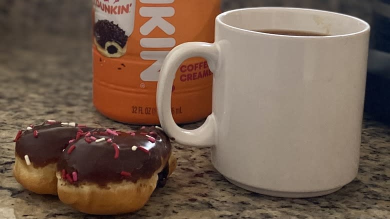 Brownie batter donut beside coffee