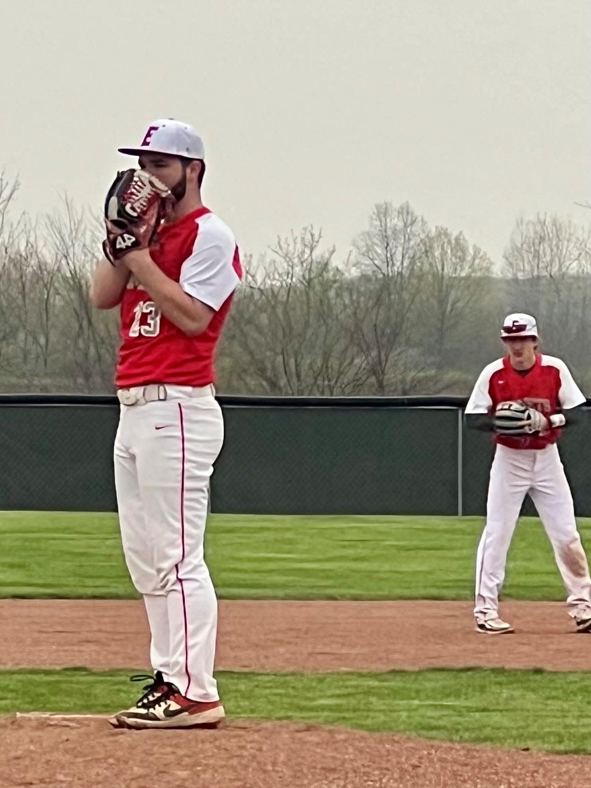 Elgin's Donaven Stith gets set to pitch during a Northwest Central Conference home baseball game with Perry on Tuesday.