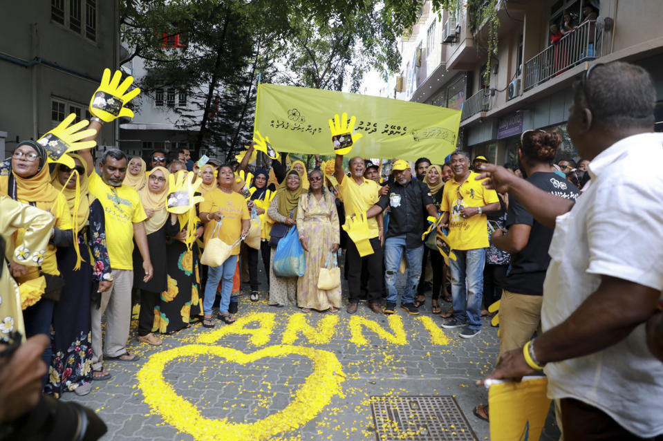 Supporters of Maldives’ former president Mohamed Nasheed, cheer upon his arrival in Maldives, Thursday, Nov.1, 2018. Nasheed, the first democratically elected president of the Maldives returned home Thursday after more than two years in exile to escape a long prison term. (AP Photo/Mohamed Sharuhaan)