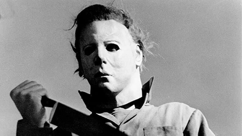 michael meyers holds a knife in a scene from halloween a good housekeeping pick for best halloween movies