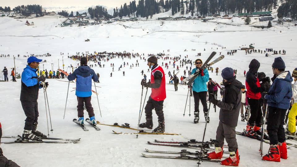 Tourists learn to ski on a gentle Gulmarg slope in February 2021. - Yawar Nazir/Getty Images