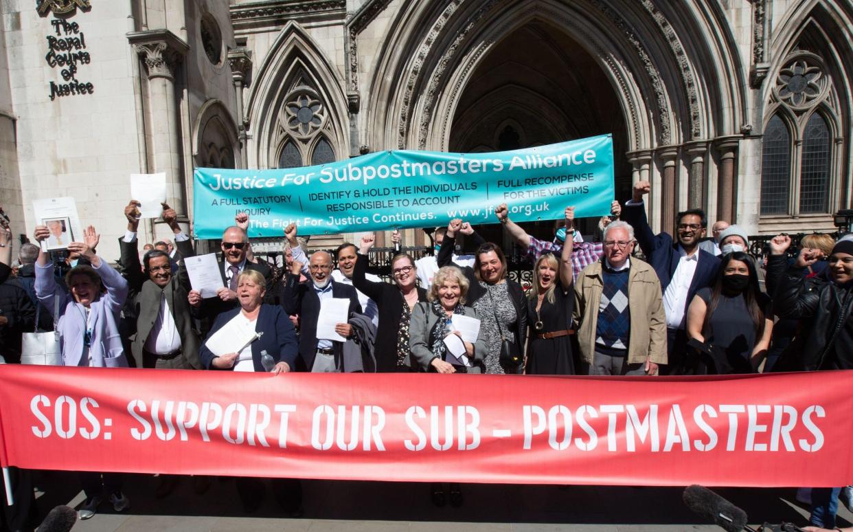 Postmasters celebrate outside the High Court after their convictions were quashed