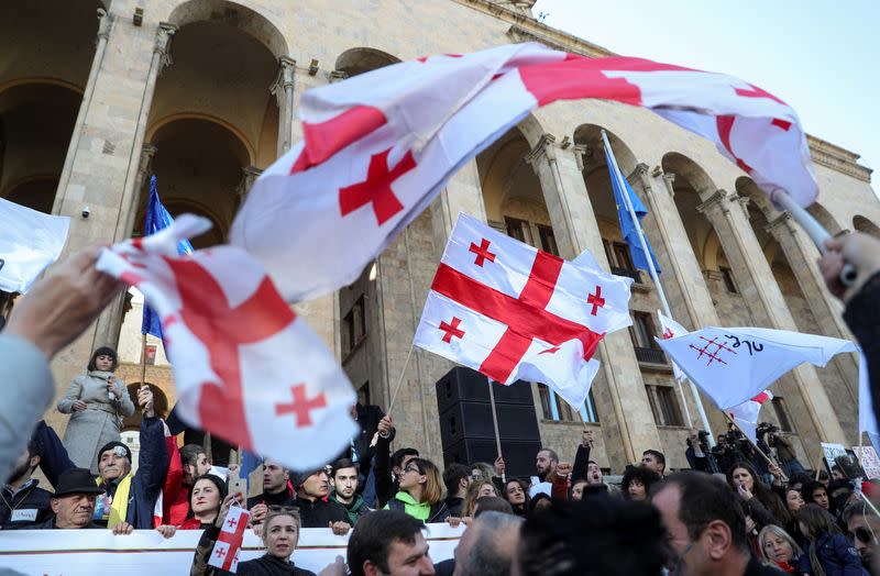 FILE PHOTO: Opposition supporters take part in a rally to protest against the government and demand an early parliamentary election in Tbilisi