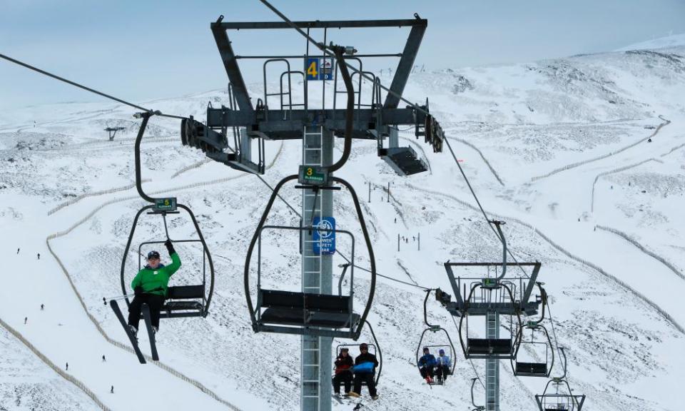 Skiers and snowboarders at Glenshee Ski Centre.