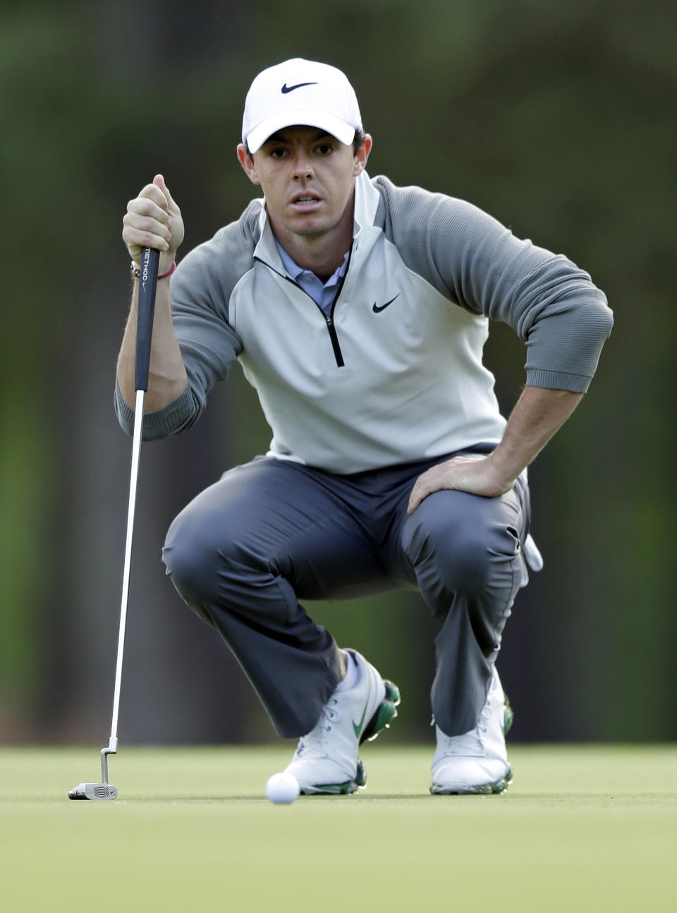 Rory McIlroy lines up a putt on the 11th hole during the first round of the Wells Fargo Championship golf tournament in Charlotte, N.C., Thursday, May 1, 2014. (AP Photo/Chuck Burton)