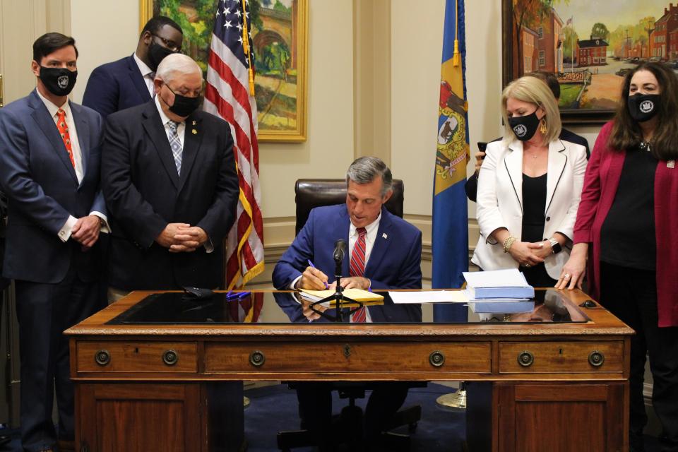 Delaware Gov. John Carney signed the state budget into law on June 30, 2021.