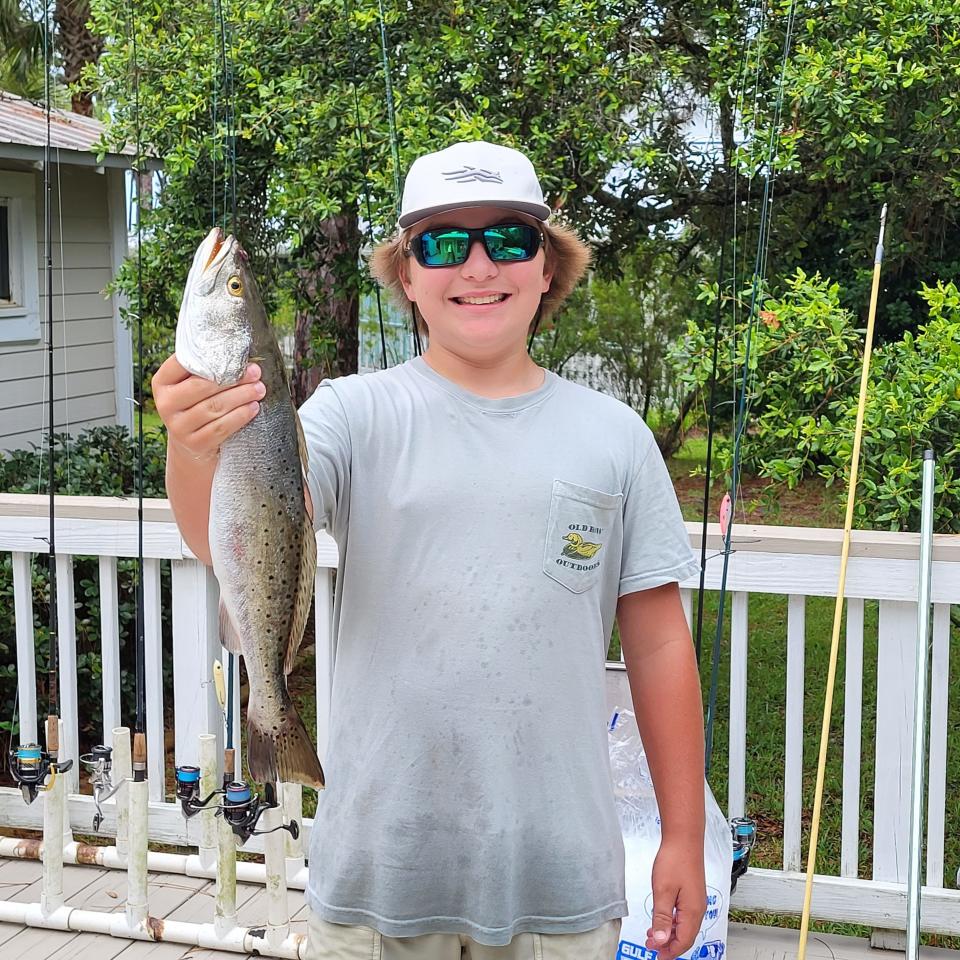 River Sasser picked up a fine 21.5 inch summertime trout along with a handful of upper slot fish while working topwater with a bone One Knocker off St. Teresa. (my hometown fishing photo)
