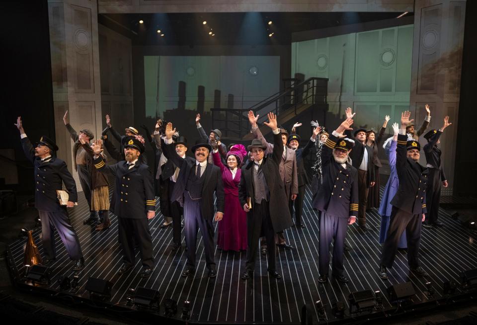Cast members wave in "Titanic the Musical," staged by Milwaukee Repertory Theater.